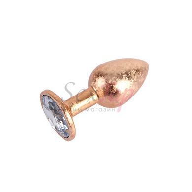Анальная пробка золотистого цвета с сиреневым кристаллом Chisa Nebula Gem Butt Plug размер Small &mdash;  фото товара 3